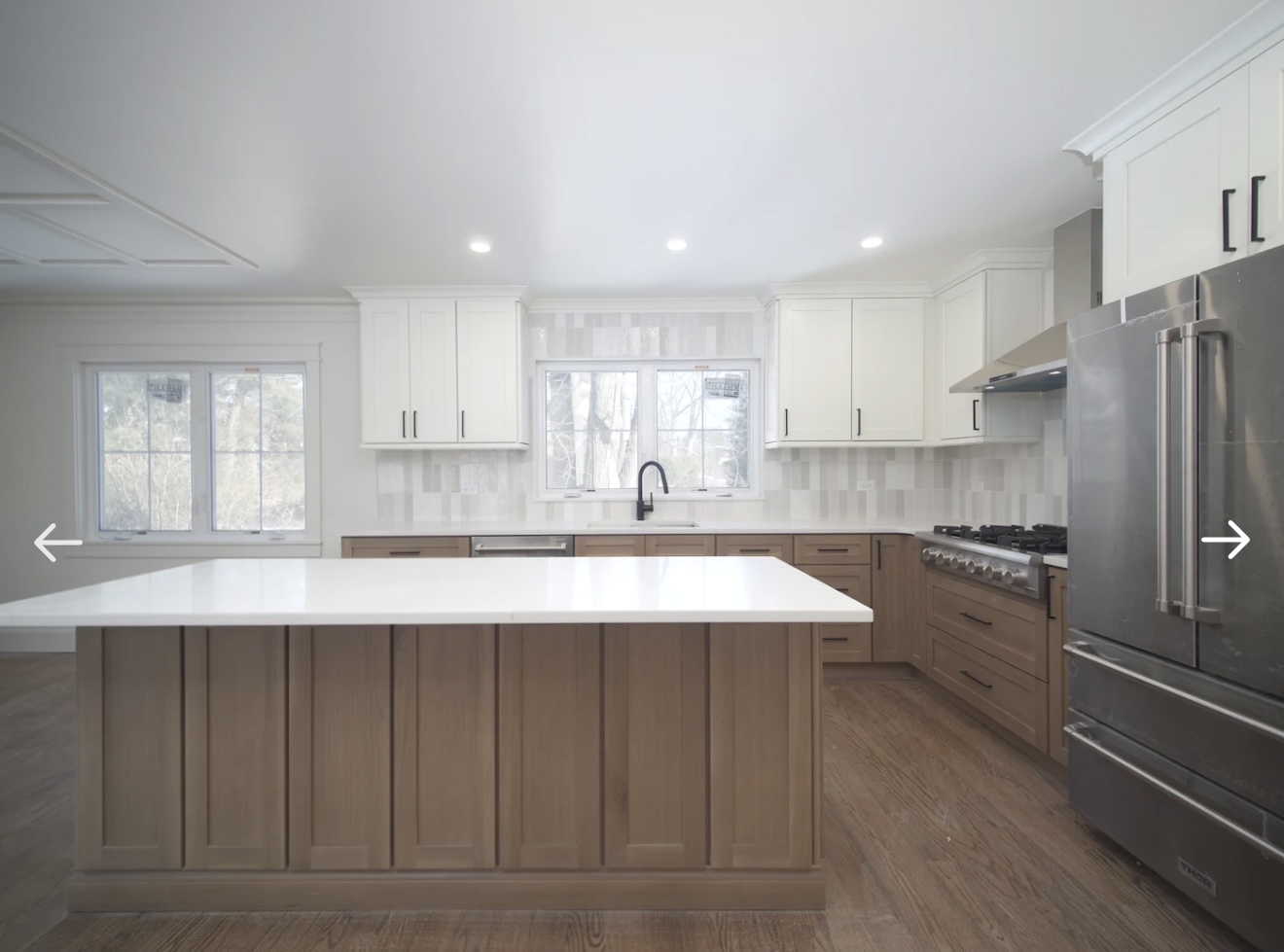 Full kitchen with island, backsplash, and Thor appliances